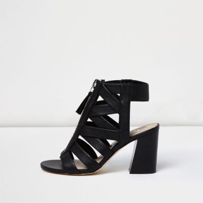 Black zip front strappy shoe boots